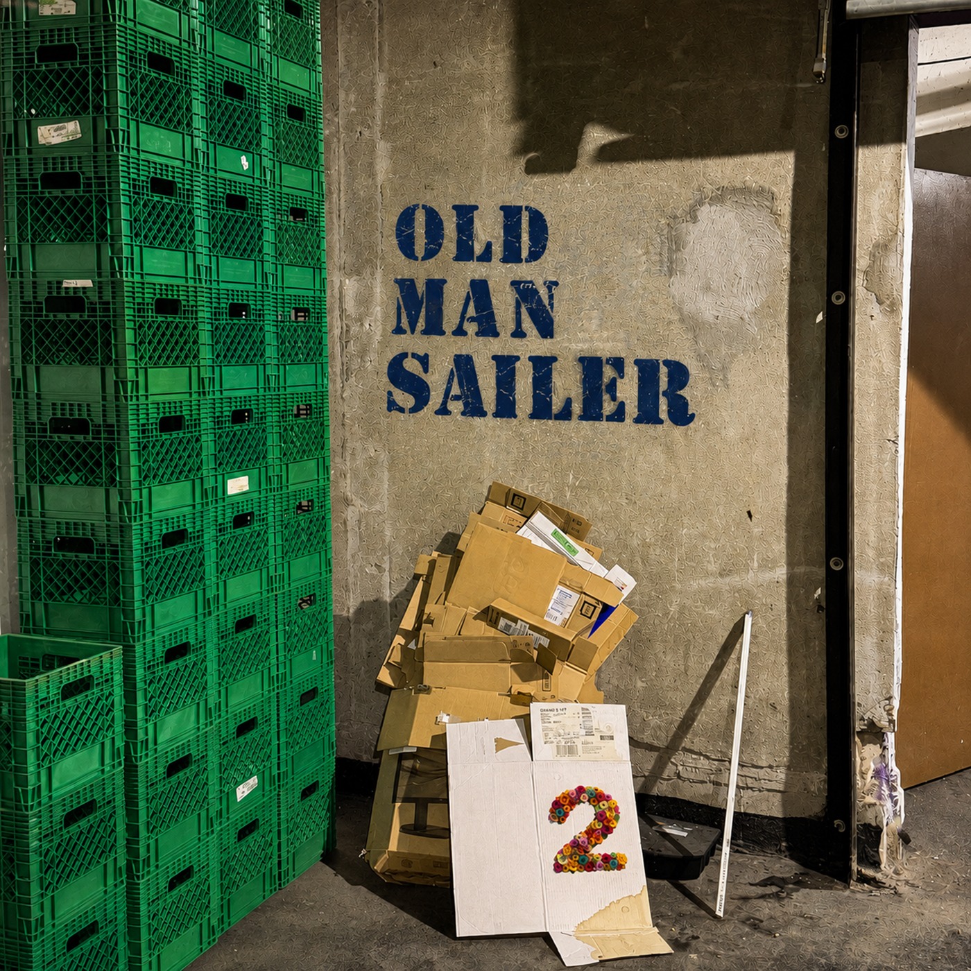 Actual Old Man Sailer 2 album cover: green crates and cardboard with a floral 2.
